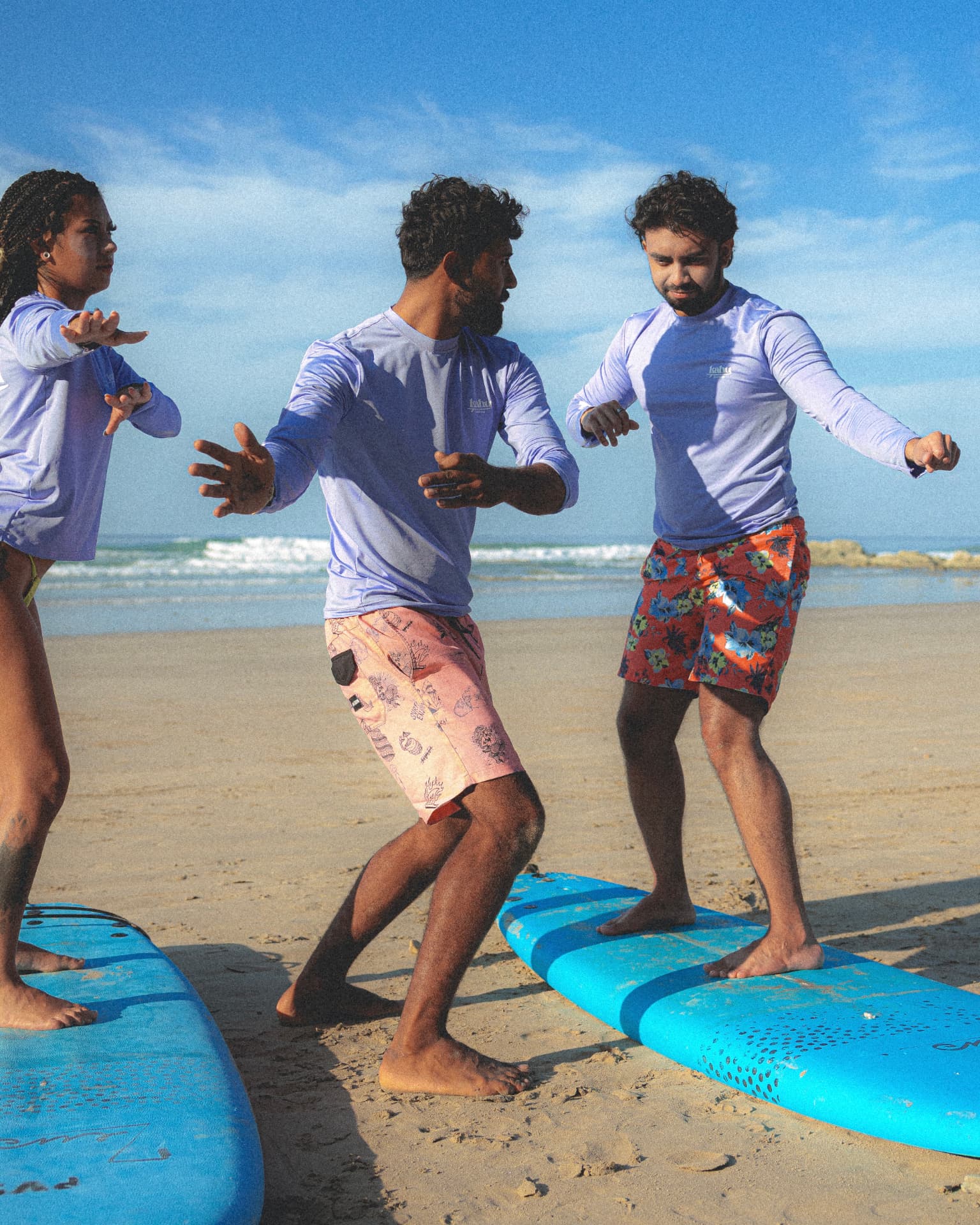 Instructor teaching the pop-up on the sand